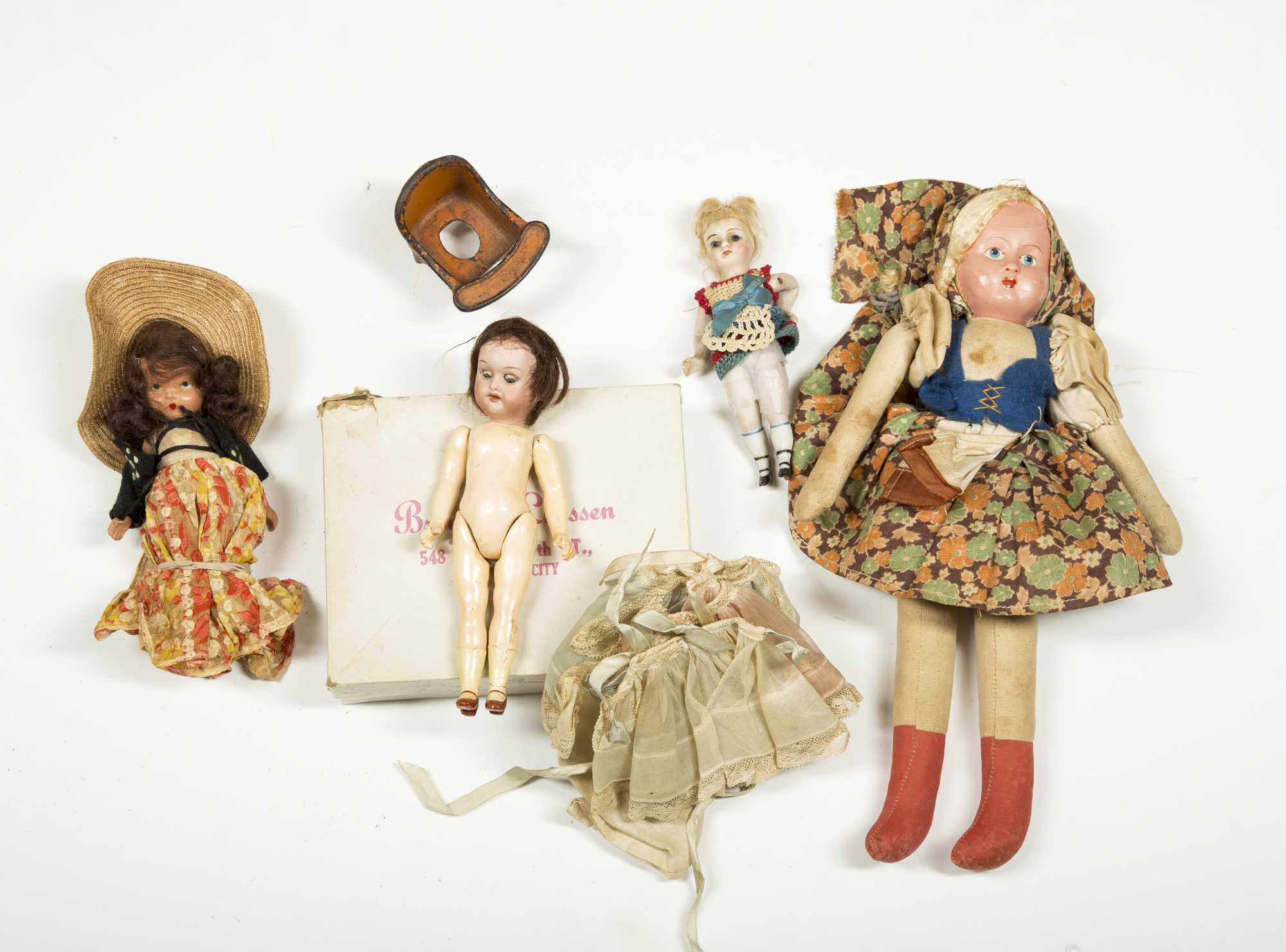 Three Dolls And Iron Potty Chair